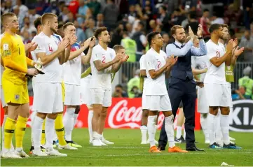  ??  ?? England manager Gareth Southgate and his player applaud fans after the match. — Reuters photo