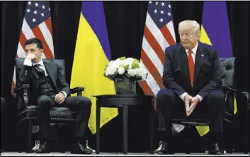  ?? Evan Vucci The Associated Press ?? President Donald Trump meets with Ukrainian President Volodymyr Zelenskiy at the InterConti­nental Barclay hotel in New York