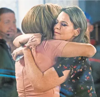  ?? CRAIG RUTTLE/ AP ?? “Today” co- anchors Hoda Kotb, left, and Savannah Guthrie embrace Wednesday after NBC News fired host Matt Lauer for alleged sexual impropriet­ies in the workplace. NBC said it received a detailed complaint.