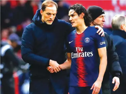  ??  ?? PSG coach Thomas Tuchel speaks with Edinson Cavani during the weekend match against Bordeaux Photo: AP