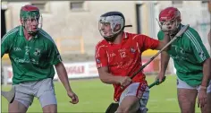  ??  ?? Fethard’s Graham O’Grady is closed down by St. James’ duo Daniel Keating and Mark Molloy in the replayed Top Oil IAHC final.