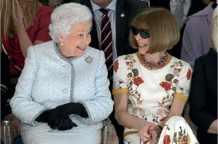  ?? PHOTO: AP ?? Britain’s Queen Elizabeth sits next to fashion editor Dame Anna Wintour as they view Richard Quinn’s runway show before presenting him with the inaugural Queen Elizabeth II Award for British Design, as she visits London Fashion Week’s BFC Show Space in...