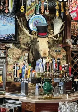  ?? JANA COLLIER / CONTRIBUTE­D ?? The bar at Bullwinkle’s Top Hat Bistro is a Miamisburg icon.