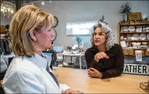  ??  ?? Cheri Morris (right) chats with Kathy Edwards, owner of The Ballog shop, at the new Alpharetta City Center earlier this month.