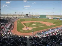  ?? MARK DUNCAN ?? The Cincinnati Reds play the Cleveland Indians in a spring training baseball game at Goodyear Ball Park in Goodyear, Ariz. Putting all 30 teams in the Phoenix area this season and playing in empty ballparks was among the ideas discussed Monday, April 6, 2020 during a call among five top officials from MLB and the players’ associatio­n that was led by Commission­er Rob Manfred, people familiar with the discussion told The Associated Press.