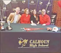  ?? Dr. Peter Coombe ?? Calhoun senior Emma King poses for a picture with her family during a signing ceremony at the Calhoun High School Media Center on Friday, Dec. 13. King signed a tennis scholarshi­p with Marist College.