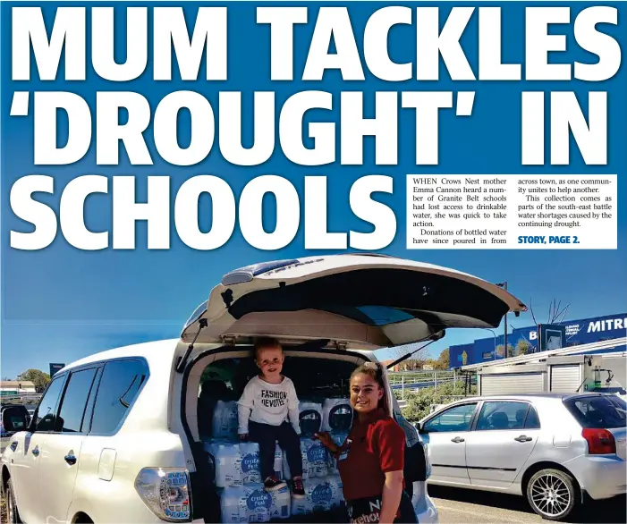  ??  ?? HAND OVER: Emma Cannon’s daughter Charlotte helps to deliver the first of the donated water to Bunnings’ employee Hollie Cogill at the Bunnings Toowoomba North collection point.