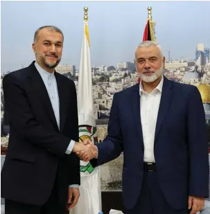  ?? (Iran’s Foreign Ministry/West Asia News Agency/Reuters) ?? IRAN’S FOREIGN MINISTER Hossein Amirabdoll­ahian and Hamas leader Ismail Haniyeh meet in Doha in December. ‘The only thing we have in common with the Israeli government is that we also don’t believe in the two-state solution,’ says the foreign minister.