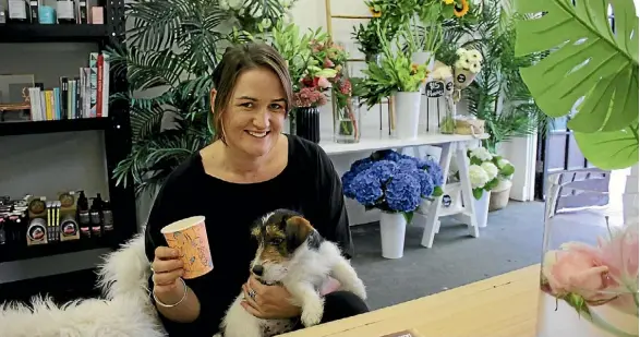  ?? JANE MATTHEWS/FAIRFAX NZ ?? Grace McCallum’s new store in Hawera, This Plus That, really does live up to its name - there’s everything from flowers to a puppy.