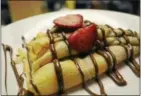  ??  ?? Perk’s classic crepe is made with Nutella and fresh bananas.