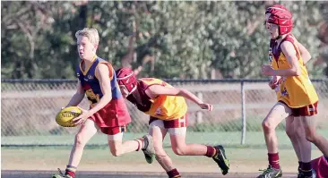  ??  ?? (7351) Colts player Logan Wallmeyer clears from defence during the under 12 match against Drouin Cobras.