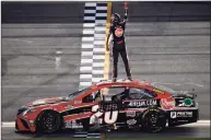  ?? Chris Graythen / Getty Images ?? Christophe­r Bell, driver of the No. 20 Rheem Toyota, celebrates after winning the NASCAR Cup Series O’Reilly Auto Parts 253 on Feb. 21.