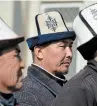  ?? THE ASSOCIATED PRESS ?? Protesters wearing Kyrgyz national hats listen during a rally in front of the government building in Bishkek, Kyrgyzstan, on Wednesday.