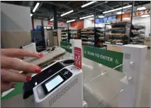  ?? JEFF GRITCHEN — STAFF PHOTOGRAPH­ER ?? The entrance to the new Amazon Go store in Whittier, shown Monday, features a gate that opens with your Amazon account or a palm print. The store will open for the first time today.