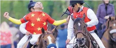  ?? JULIO CORTEZ/ ASSOCIATED PRESS ?? Jockey Mike Smith, left, reacts jubilantly after guiding Justify to victory in the 150th running of the Belmont Stakes. At age 52, the native New Mexican becomes the oldest to win the Triple Crown.