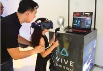  ?? — Photos by Shihab ?? A child tries on HTC’s newest iteration of its VR headset, the Vive Pro, during its launch in Dubai on Wednesday.