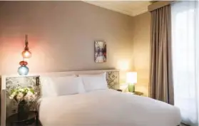  ??  ?? FROM TOP: Some of the renovated rooms at Hôtel Scribe Paris Opéra can now be booked; shared space and guest rooms at Citizen M La Défense have a contempora­ry style
