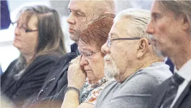  ?? GEOFF ROBINS THE CANADIAN PRESS ?? Patricia Houde, centre, and husband Jon Matheson, whose mother was among Elizabeth Wettlaufer’s murder victims, attend the release of Justice Eileen Gillese’s report. Matheson said he will be watching the government’s response closely.