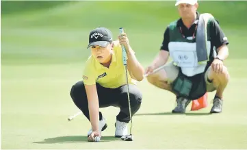  ??  ?? Lydia Ko of New Zealand lines up her putt on the second hole during the final round of the KIA Classic at the Park Hyatt Aviara Resort in Carlsbad, California. — AFP photo