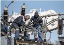  ??  ?? GOING GETS TOUGH. Technician­s assembling a new transforme­r at the Eikenhof substation.