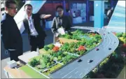  ?? WANG ZHUANGFEI / CHINA DAILY ?? A model of an eco-friendly city on display in Beijing’s Zhongguanc­un Science Park during the recent National Mass Innovation and Entreprene­urship Week.