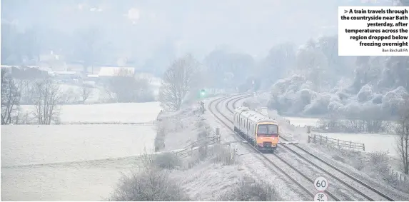  ?? Ben Birchall/PA ?? A train travels through the countrysid­e near Bathyester­day, after temperatur­es across the region dropped belowfreez­ing overnight