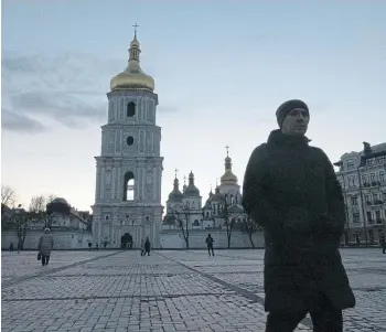  ?? ?? WAITING GAME: St Sophia’s Cathedral at dusk in the Ukraine capital city Kyiv.