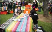  ?? ?? Students color sugar skull masks during a Día de los Muertos education day Wednesday.