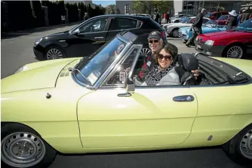  ?? PHOTOS: VIRGINIA WOOLF/STUFF ?? Mark and Marama Quinney arrive at the WOW car park to join the Alfa Romeo Owners Club’s Show and Shine event.