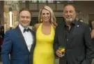  ?? Emily Matthews/Post-Gazette ?? Broadway performer Billy Hartung, left, event chair Brenda Tenison and former racer and team owner Bobby Rahal at the Black Tie & Tailpipes gala Friday to kick off the Vintage Grand Prix at Valley Brook Country Club in Canonsburg. See video at post-gazette.com.