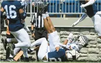  ?? ?? Penn State wide receiver Mitchell Tinsley catches a touchdown pass during an April 23 spring game in State College.