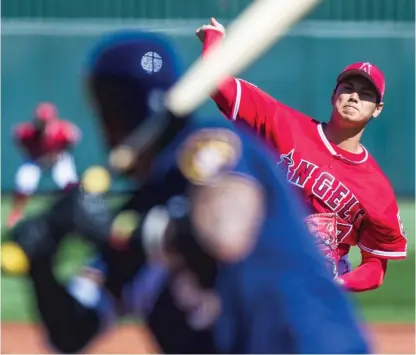  ??  ?? Shohei Ohtani’s breaking pitches looked sharp Saturday in his Cactus League debut against the Brewers. | ROB TRINGALI/ GETTY IMAGES