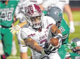  ?? [PHOTO BY ALONZO ADAMS FOR THE OKLAHOMAN] ?? Jenks running back Noah Hernandez makes a touchdown against Edmond Santa Fe during Friday’s game in Edmond. Jenks won, 49-8.