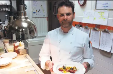  ?? Stephen Fries / Contribute­d photo ?? Roia’s Executive Chef and owner Avi Szapiro with the finished roasted and raw beets dish.