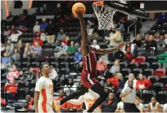  ?? (Special to the Commercial/ William Harvey) ?? Pine Bluff senior Courtney Crutchfiel­d attempts a driving layup against Jacksonvil­le during Friday’s 5A second-round playoff game at Searcy High School.