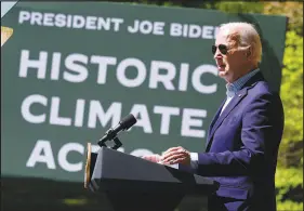  ?? MANUEL BALCE CENETA / ASSOCIATED PRESS ?? President Joe Biden speaks on Earth Day, April 22, at Prince William Forest Park in Triangle, Va. Biden is announcing $7 billion in federal grants to provide residentia­l solar projects serving low- and middle-income communitie­s and expanding his American Climate Corps green jobs training program.