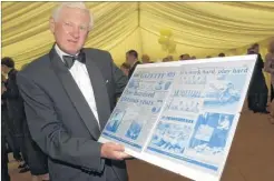  ??  ?? Geoffrey at the 100th birthday party for Barretts with a Gazette front page