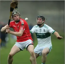  ??  ?? Glenealy’s Danny Staunton makes a clearance as Keith Murphy of Portlaoise closes in.