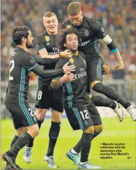  ?? AFP ?? Marcelo (centre) celebrates with his teammates after scoring Real Madrid's equaliser.