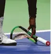  ?? Sarah Stier / Getty Images ?? This broken racket earned Williams a penalty point from the chair umpire.