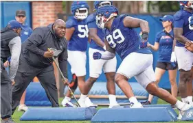  ?? DOUG ENGLE/GAINESVILL­E SUN ?? Florida’s defensive lineman Cam Jackson (99) runs a drill during practice. Florida held their second spring football practice on March 9.