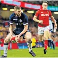  ??  ?? Mission impossible: Finn Russell tries to lift Scotland during their crushing defeat