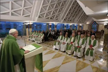  ?? L’OSSERVATOR­E ROMANO — POOL PHOTO VIA AP ?? Pope Francis speaks as he celebrates Mass at the Santa Marta residence at the Vatican, Tuesday.