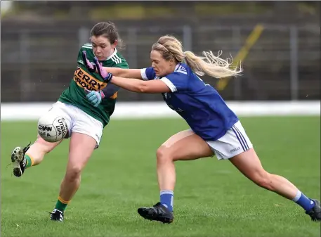  ?? Photo by Michelle Cooper Galvin ?? Kerry’s Anna Galvin drives the ball past Cavan’s Mona Sheridan in the NFL in Fitzgerald Stadium on Sunday.