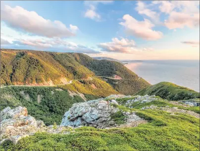  ?? CONTRIBUTE­D PHOTO ?? The Cabot Trail is seen from the Skyline Trail at sunset in Cape Breton Highlands National Park. Cape Breton tourism operators saw widespread declines in visitor traffic over the summer months after the record numbers set in 2017 from the year-long Canada 150 celebratio­ns.