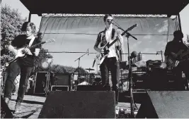  ?? DIMITRIOS KAMBOURIS Getty Images for Anheuser-Busch/TNS ?? From left, Nathan Stocker, Jake Luppen and Zach Sutton of Hippo Campus are shown at a 2015 performanc­e. Stocker, Luppen and Caleb Hinz have recorded a spinoff album.