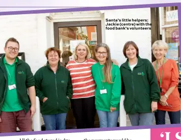  ??  ?? Santa’s little helpers: Jackie (centre) with the food bank’s volunteers