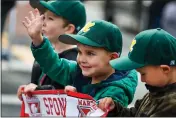  ?? ?? Liam Apperson, 4, waves to his father, Ryan, who was watching along with other spectators during the Martinez baseball parade on Main Street in Martinez.