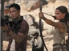  ?? ILZE KITSHOFF/WARNER BROS. PICTURES VIA AP ?? This image released by Warner Bros. Pictures shows Daniel Wu, left, and Alicia Vikander in a scene from “Tomb Raider.”