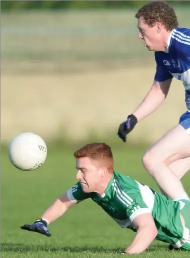  ??  ?? Aaron Rogers, St. Patrick’s loses out to Dundalk Gaels’ Eamon Kenny. Picture: Ken Finegan